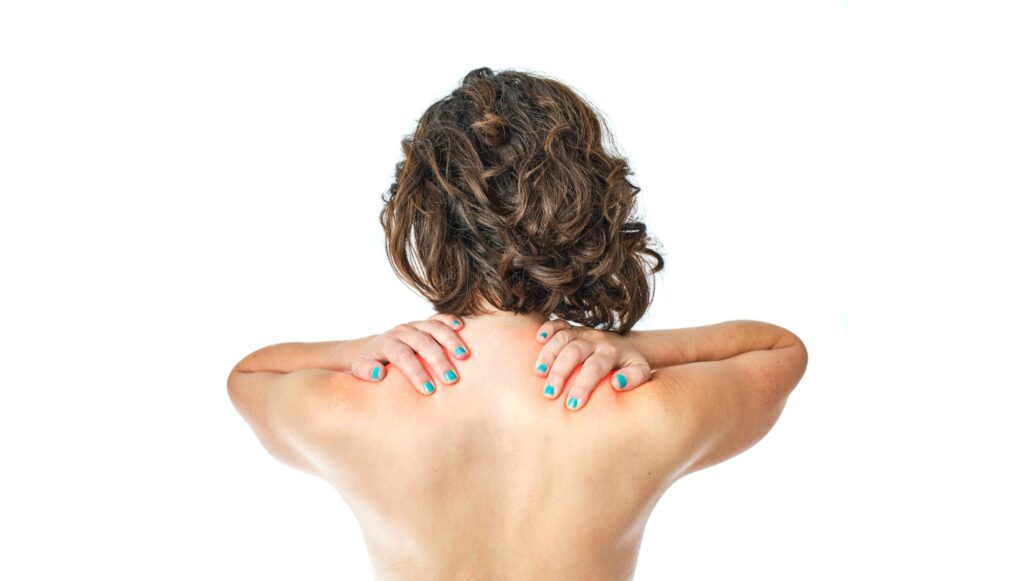 woman on her back with cervical pain on white background